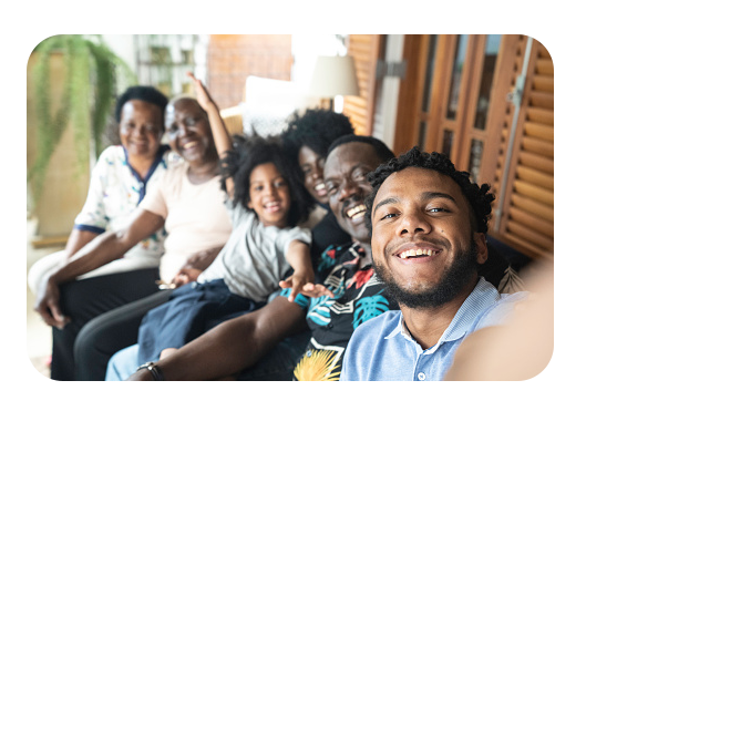young black man taking selfie with family